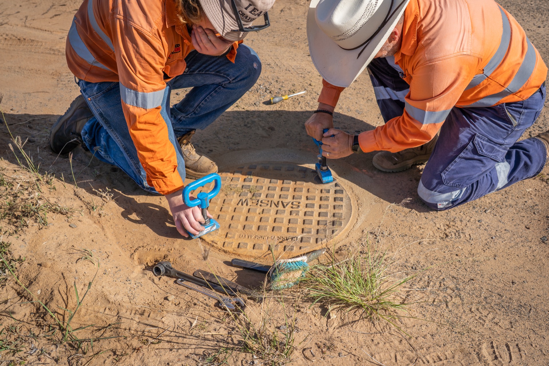 GeoRadar locators checking a buried service cover against the plans